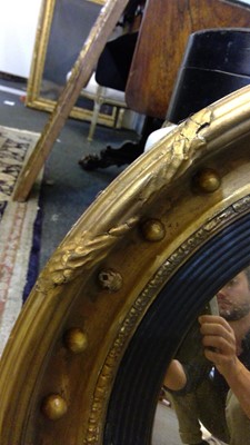 Lot 540 - A Regency gilt convex mirror
