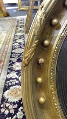 Lot 540 - A Regency gilt convex mirror