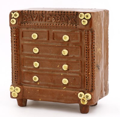Lot 530 - A pottery chest of drawers money bank