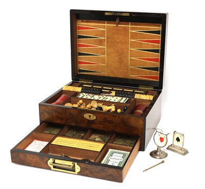 Lot 633 - A Victorian walnut games compendium