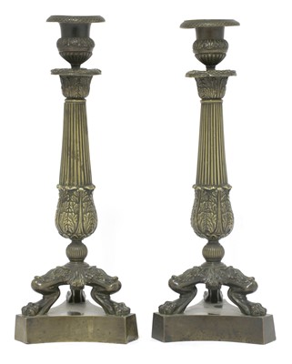 Lot 549 - A pair of French bronze candlesticks
