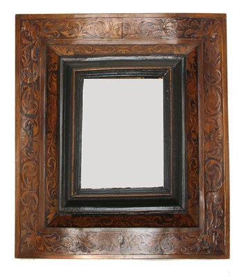 Lot 608 - A marquetry inlaid cushion-framed mirror