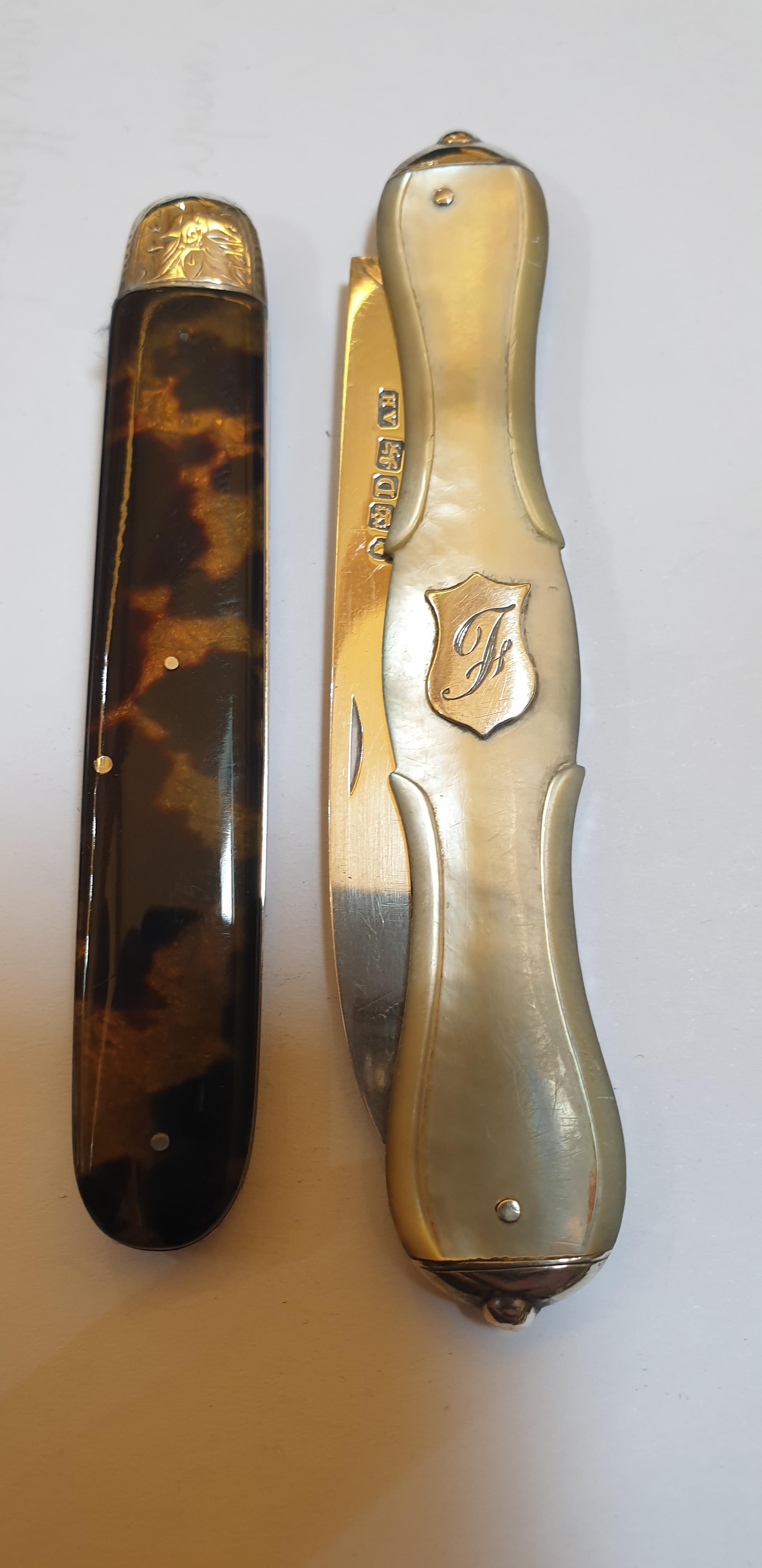 Lot 45 - Five various silver folding fruit knives and