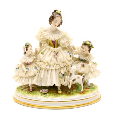 Lot 156 - A modern Dresden figure group of a mother and children with a pet lamb