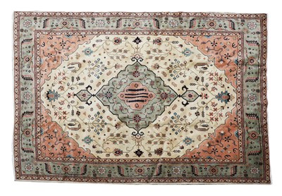 Lot 606 - A Persian Heriz carpet