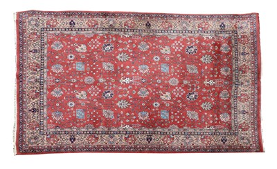 Lot 213 - A Persian Heriz carpet