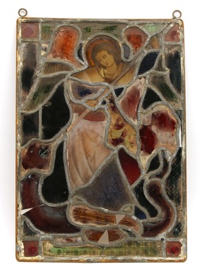 Lot 33 - A stained glass panel of an angel lancing a dragon