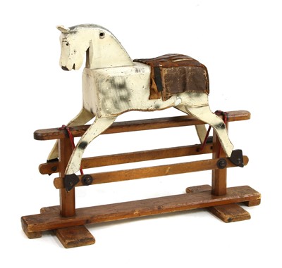 Lot 183 - A cream painted wooden rocking horse