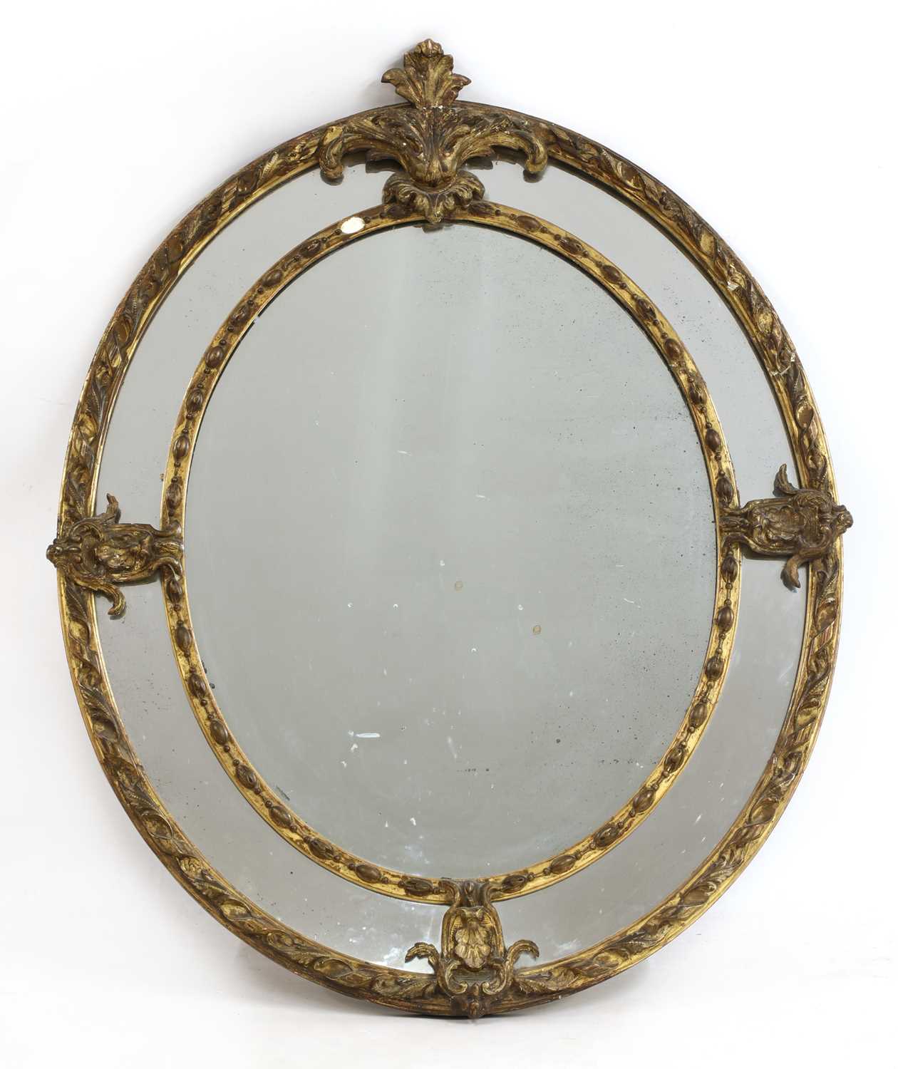 Lot 166 - A large oval gilt wall mirror
