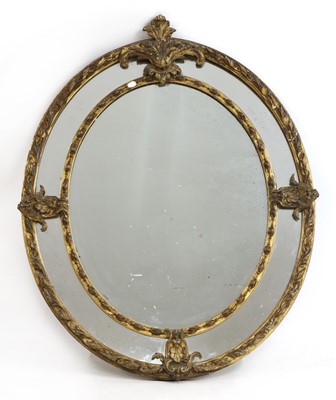 Lot 166 - A large oval gilt wall mirror