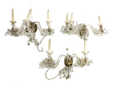 Lot 678 - A pair of neoclassical-style three-branch wall lights