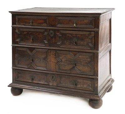 Lot 650 - An oak mitre front chest