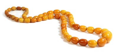 Lot 112 - A single row graduated oval butterscotch amber bead necklace