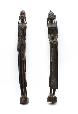 Lot 266 - A pair of African carved ebony figures of water carriers