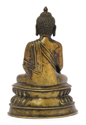 Lot 213 - A Tibetan bronze Shakyamuni Buddha