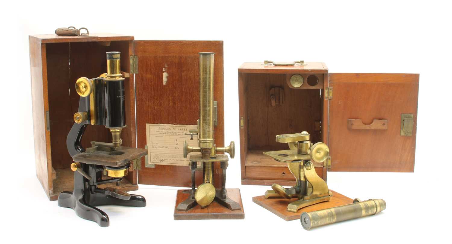 Lot 405 - A black lacquered monocular microscope,