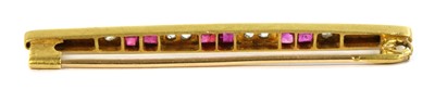 Lot 35 - An Art Deco, gold, ruby and diamond bar brooch
