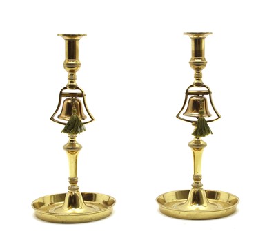 Lot 387 - A pair of 18th century brass candlesticks with bell columns and galleried tray bases