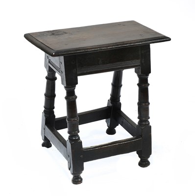 Lot 780 - An oak joint stool