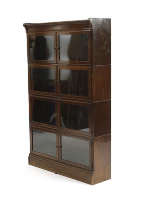 Lot 454 - A mahogany four section bookcase by Minty of Oxford