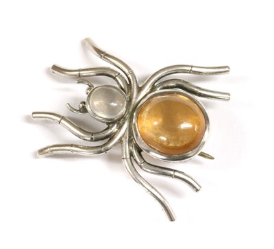 Lot 192 - A silver gem set spider brooch