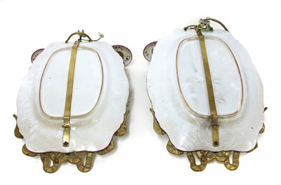Lot 235 - A pair of French faience wall lights