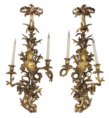 Lot 580A - A pair of Chippendale-style carved giltwood wall sconces