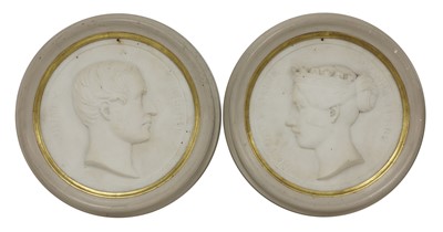Lot 118 - A pair of carved marble roundels