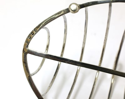 Lot 16 - A George III silver oval eight-division toast rack