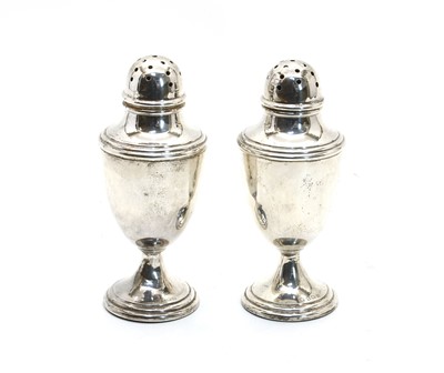 Lot 151 - A pair of George V casters of urn design
