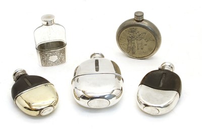 Lot 188 - A silver and leather clad glass spirit flask