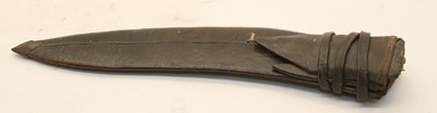 Lot 215 - A Kukri in leather scabbard with two smaller knives
