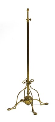 Lot 204 - An Arts and Crafts brass standard lamp
