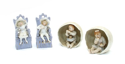 Lot 293 - A pair of bisque child figures