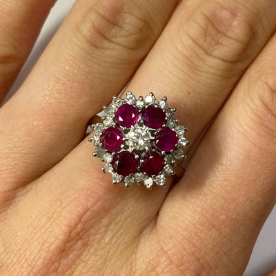 Lot 44 - A white gold diamond and ruby target cluster ring