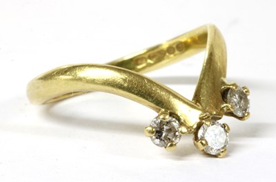 Lot 191 - An 18ct gold three stone diamond ring