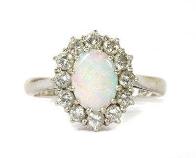Lot 122 - A white gold opal and diamond cluster ring