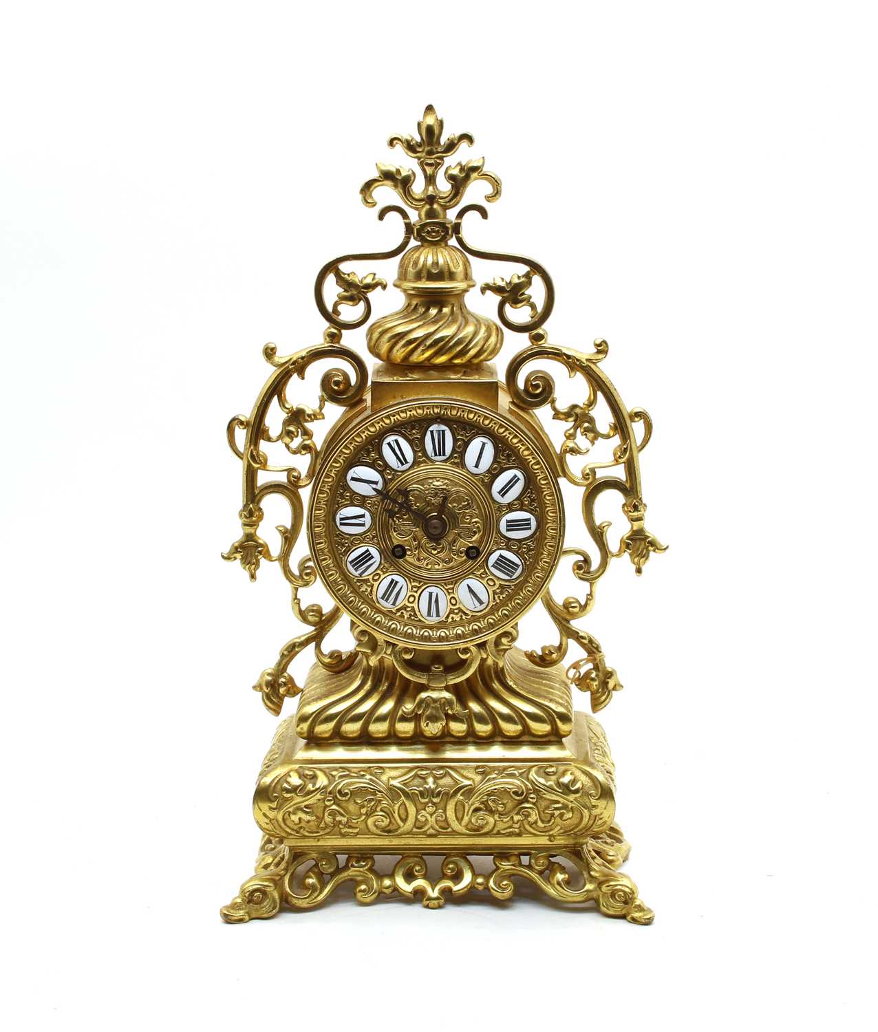 Lot 570 A French ornate brass mantle clock