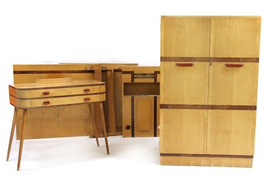Lot 529 - A maple and walnut suite of bedroom furniture