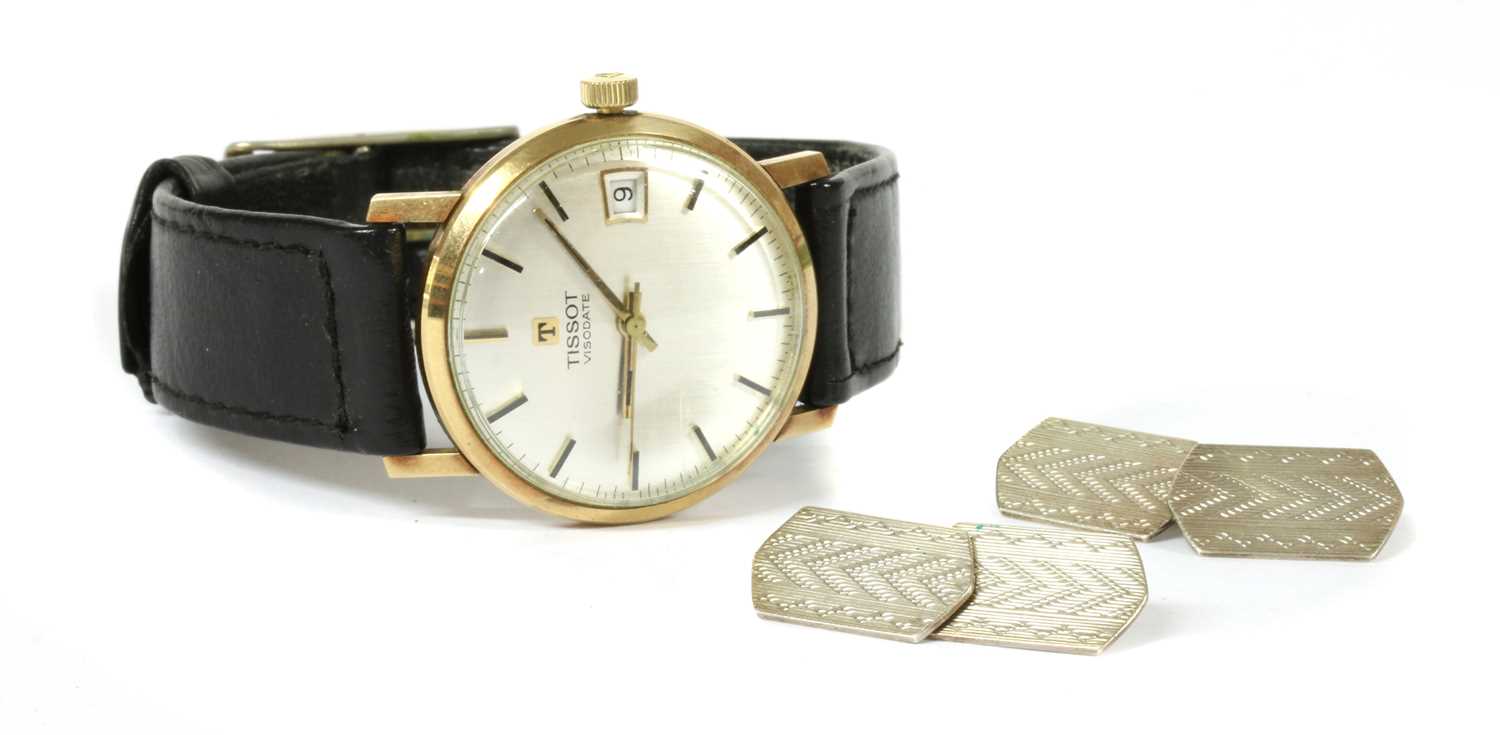 Lot 164 A mid size 9ct gold Tissot Visodate