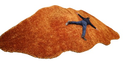 Lot 397 - An Alton-Brooke ginger thick shag pile rug