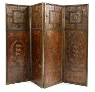Lot 887 - An oak and embossed leather four fold screen