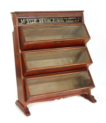 Lot 718 - An early 20th century biscuit display cabinet