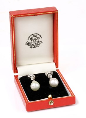 Lot 218 - A pair of cultured South Sea pearl and diamond drop earrings