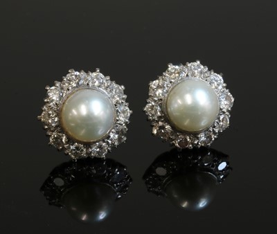 Lot 229 - A pair of cultured pearl and diamond cluster earrings