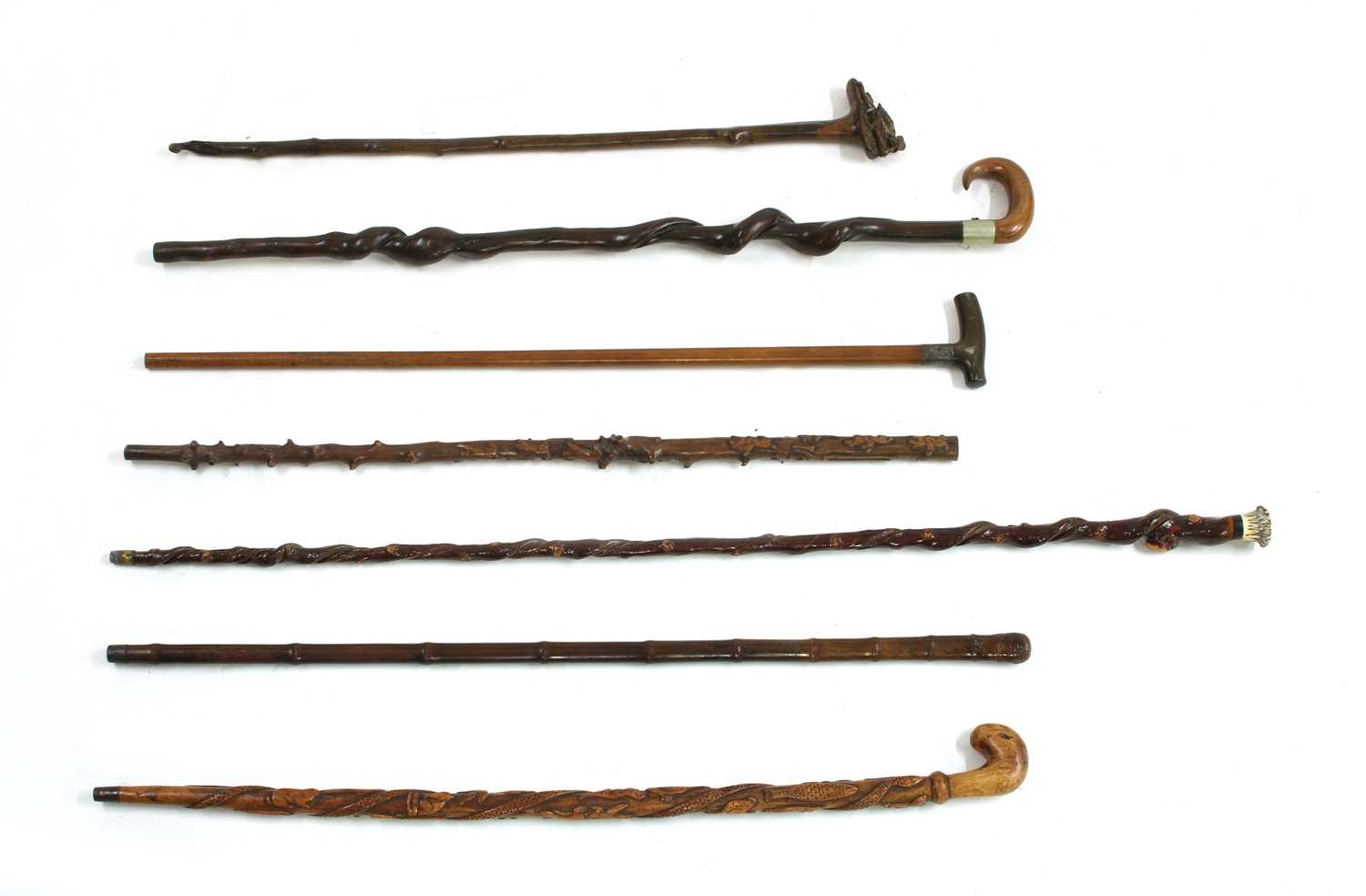Lot 35 - Seven walking sticks,
