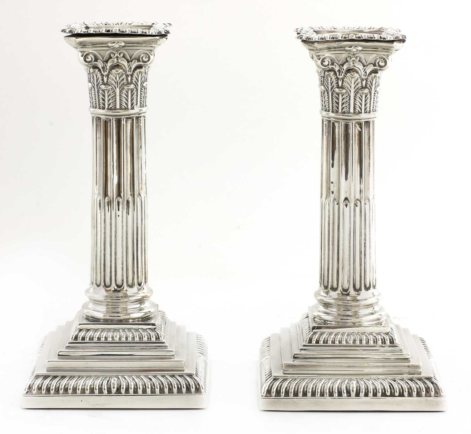 Lot 25 - A pair of Victorian silver Corinthian column candlesticks