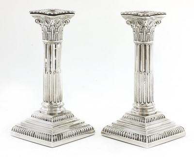 Lot 25 - A pair of Victorian silver Corinthian column candlesticks