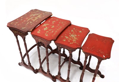 Lot 218 - A nest of four red lacquer occasional tables