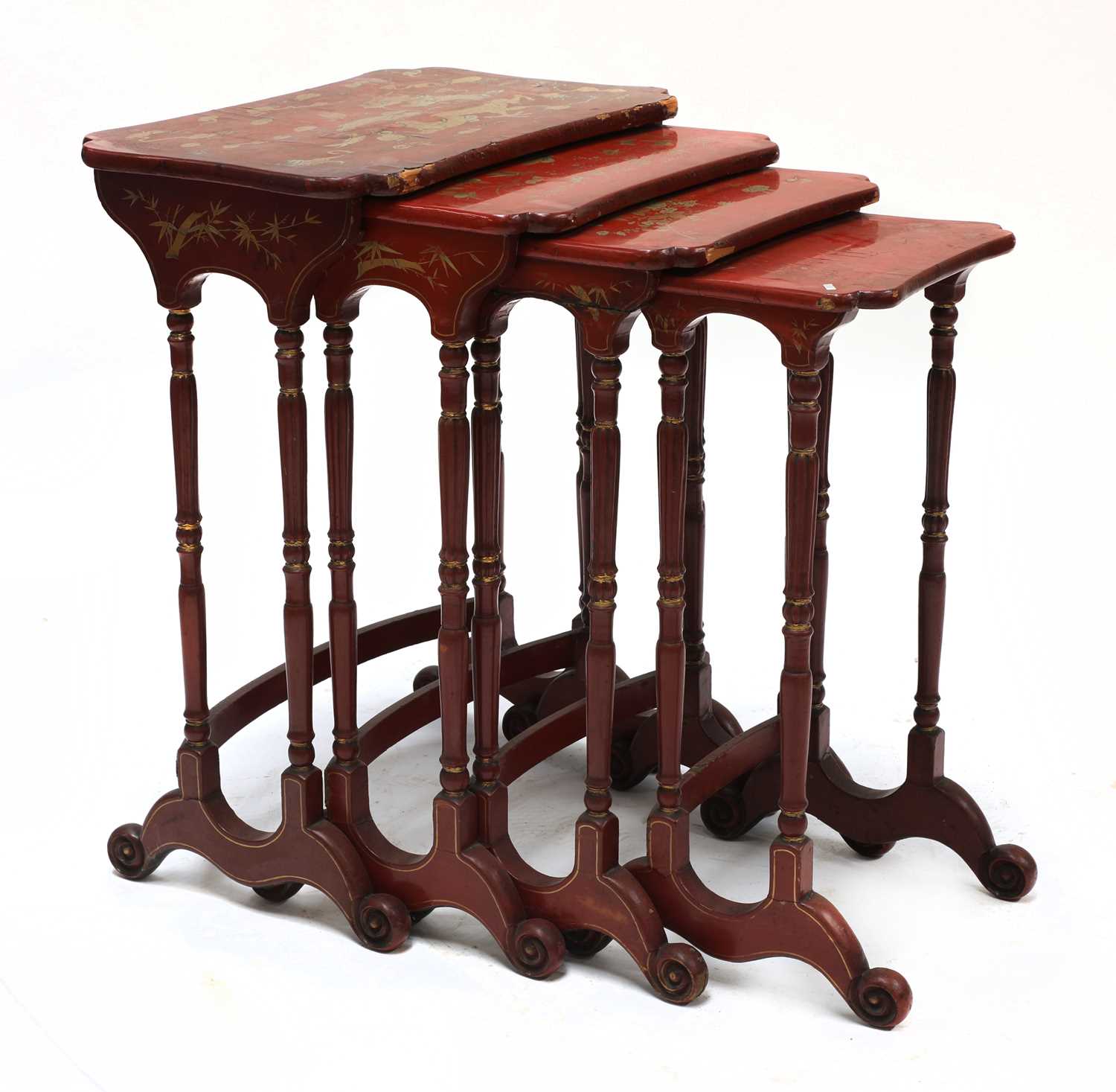 Lot 218 - A nest of four red lacquer occasional tables